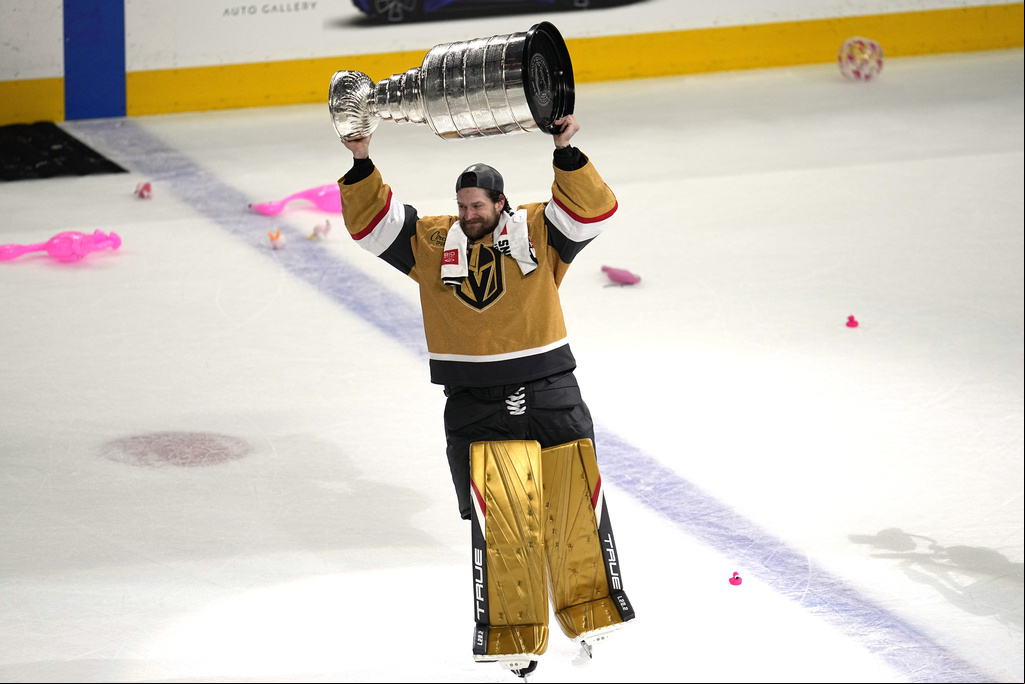 Vegas Golden Knights goalie holding Stanley Cup